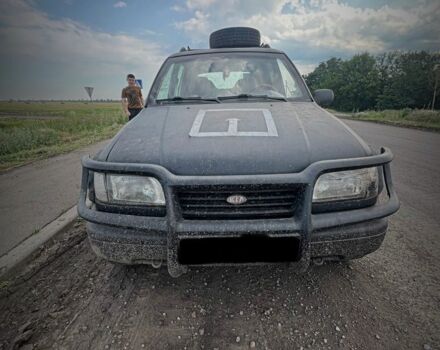 Черный Киа Sportage, объемом двигателя 2 л и пробегом 240 тыс. км за 2000 $, фото 1 на Automoto.ua