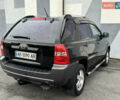 Черный Киа Sportage, объемом двигателя 2 л и пробегом 370 тыс. км за 6500 $, фото 11 на Automoto.ua