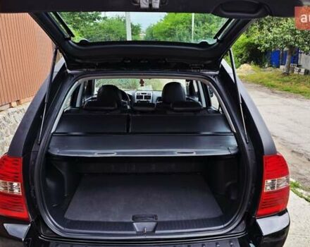Чорний Кіа Sportage, об'ємом двигуна 2 л та пробігом 172 тис. км за 7999 $, фото 60 на Automoto.ua