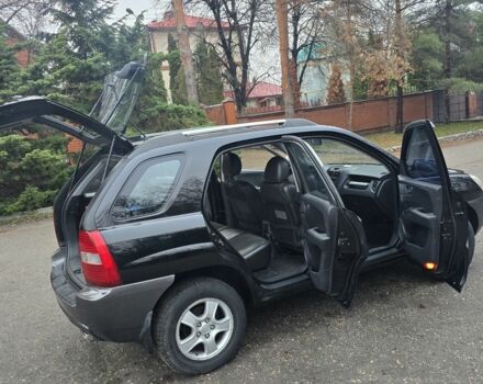 Чорний Кіа Sportage, об'ємом двигуна 2 л та пробігом 207 тис. км за 7000 $, фото 4 на Automoto.ua