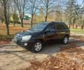 Чорний Кіа Sportage, об'ємом двигуна 2 л та пробігом 263 тис. км за 8100 $, фото 1 на Automoto.ua