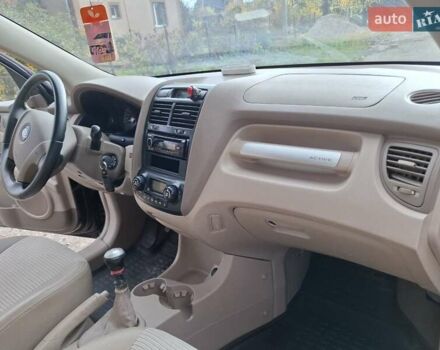 Черный Киа Sportage, объемом двигателя 1.99 л и пробегом 283 тыс. км за 6850 $, фото 55 на Automoto.ua