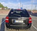 Черный Киа Sportage, объемом двигателя 2 л и пробегом 202 тыс. км за 8300 $, фото 2 на Automoto.ua