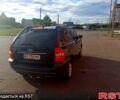 Черный Киа Sportage, объемом двигателя 2 л и пробегом 240 тыс. км за 7500 $, фото 1 на Automoto.ua