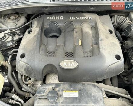 Черный Киа Sportage, объемом двигателя 2 л и пробегом 240 тыс. км за 7650 $, фото 94 на Automoto.ua