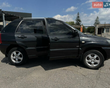 Черный Киа Sportage, объемом двигателя 2 л и пробегом 150 тыс. км за 10000 $, фото 1 на Automoto.ua