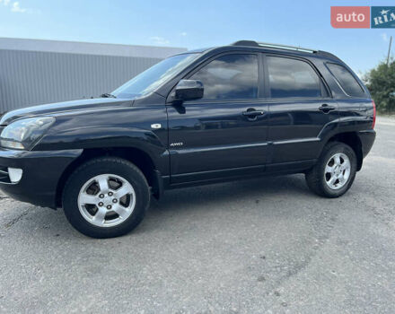 Черный Киа Sportage, объемом двигателя 2 л и пробегом 150 тыс. км за 10000 $, фото 2 на Automoto.ua