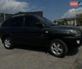 Черный Киа Sportage, объемом двигателя 2 л и пробегом 150 тыс. км за 10000 $, фото 1 на Automoto.ua