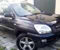 Черный Киа Sportage, объемом двигателя 2 л и пробегом 290 тыс. км за 6400 $, фото 1 на Automoto.ua