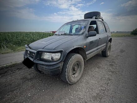 Черный Киа Sportage, объемом двигателя 2 л и пробегом 240 тыс. км за 2000 $, фото 1 на Automoto.ua