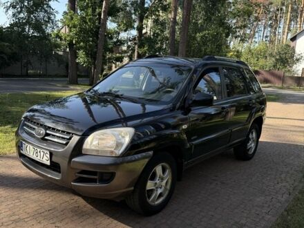 Черный Киа Sportage, объемом двигателя 2 л и пробегом 350 тыс. км за 4400 $, фото 1 на Automoto.ua