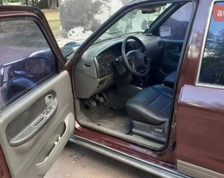 Фиолетовый Киа Sportage, объемом двигателя 2 л и пробегом 310 тыс. км за 4500 $, фото 4 на Automoto.ua