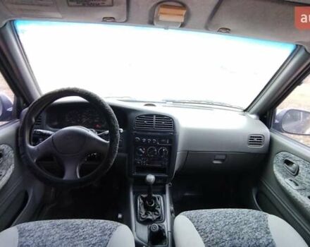 Фіолетовий Кіа Sportage, об'ємом двигуна 2 л та пробігом 155 тис. км за 3600 $, фото 8 на Automoto.ua