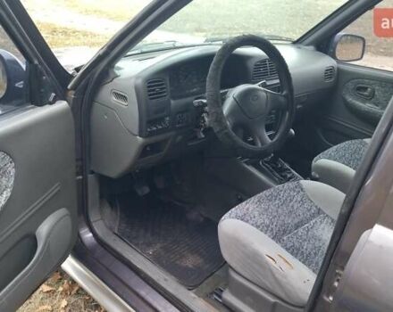 Фіолетовий Кіа Sportage, об'ємом двигуна 2 л та пробігом 155 тис. км за 3600 $, фото 7 на Automoto.ua