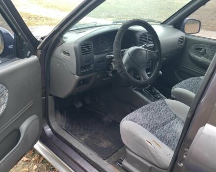 Фіолетовий Кіа Sportage, об'ємом двигуна 2 л та пробігом 200 тис. км за 3600 $, фото 7 на Automoto.ua