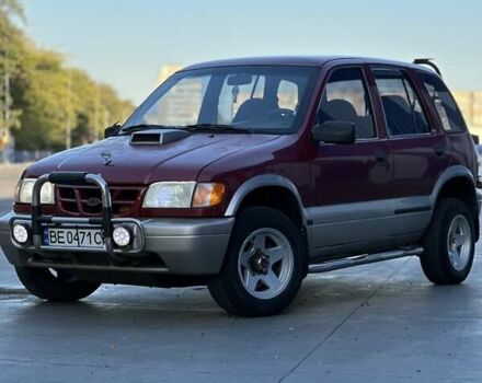 Красный Киа Sportage, объемом двигателя 2 л и пробегом 350 тыс. км за 2999 $, фото 1 на Automoto.ua