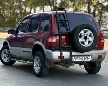 Красный Киа Sportage, объемом двигателя 2 л и пробегом 350 тыс. км за 2999 $, фото 4 на Automoto.ua