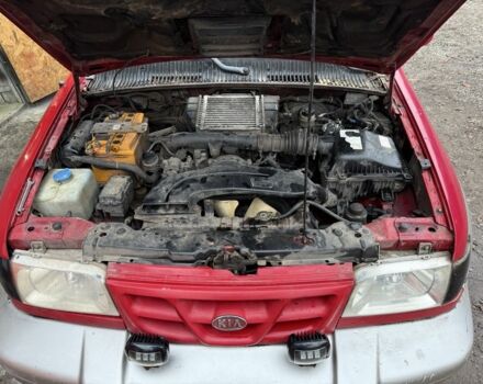 Красный Киа Sportage, объемом двигателя 2 л и пробегом 200 тыс. км за 1000 $, фото 10 на Automoto.ua