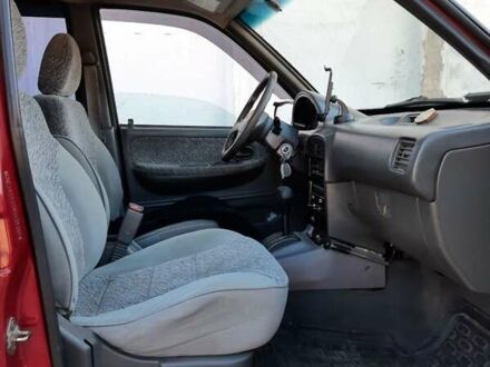 Красный Киа Sportage, объемом двигателя 2 л и пробегом 290 тыс. км за 3800 $, фото 1 на Automoto.ua