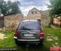 Серый Киа Sportage, объемом двигателя 2 л и пробегом 248 тыс. км за 7500 $, фото 1 на Automoto.ua