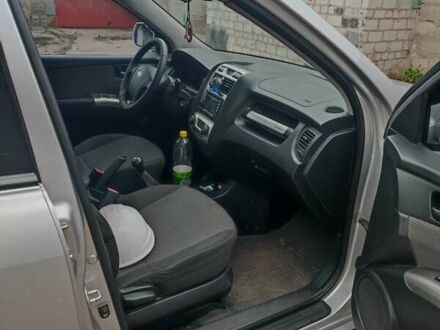 Серый Киа Sportage, объемом двигателя 2 л и пробегом 235 тыс. км за 7800 $, фото 1 на Automoto.ua