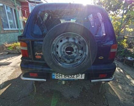 Синий Киа Sportage, объемом двигателя 2 л и пробегом 250 тыс. км за 2999 $, фото 1 на Automoto.ua