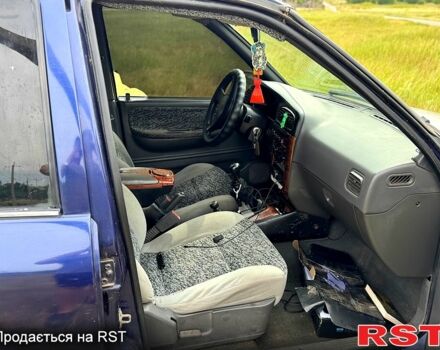 Синій Кіа Sportage, об'ємом двигуна 2 л та пробігом 200 тис. км за 3500 $, фото 4 на Automoto.ua