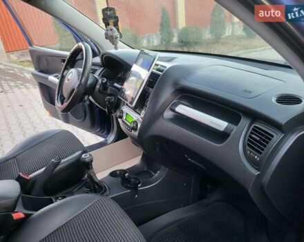 Синий Киа Sportage, объемом двигателя 1.98 л и пробегом 258 тыс. км за 7400 $, фото 79 на Automoto.ua