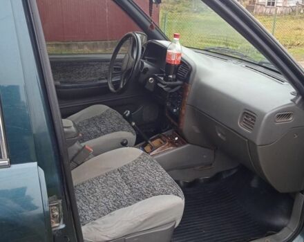 Зеленый Киа Sportage, объемом двигателя 2 л и пробегом 315 тыс. км за 3077 $, фото 6 на Automoto.ua