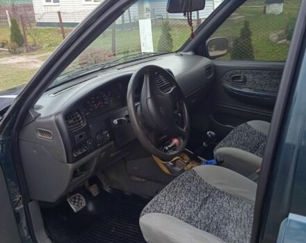 Зеленый Киа Sportage, объемом двигателя 2 л и пробегом 315 тыс. км за 3077 $, фото 2 на Automoto.ua