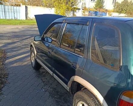 Зеленый Киа Sportage, объемом двигателя 2 л и пробегом 365 тыс. км за 4000 $, фото 3 на Automoto.ua