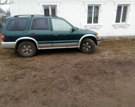 Зелений Кіа Sportage, об'ємом двигуна 2 л та пробігом 198 тис. км за 3900 $, фото 4 на Automoto.ua