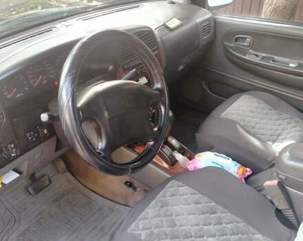 Зелений Кіа Sportage, об'ємом двигуна 2 л та пробігом 230 тис. км за 4500 $, фото 7 на Automoto.ua