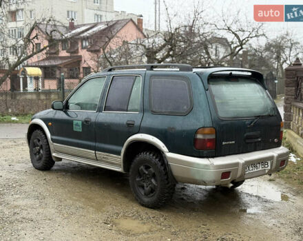 Зеленый Киа Sportage, объемом двигателя 2 л и пробегом 300 тыс. км за 3700 $, фото 4 на Automoto.ua