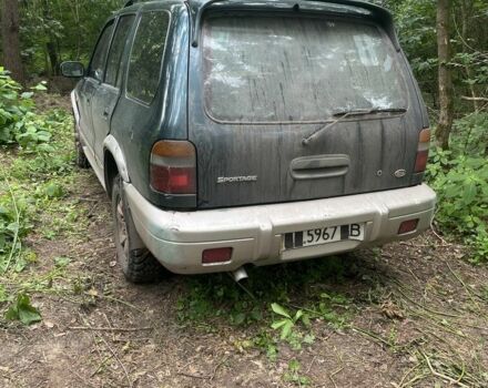Зеленый Киа Sportage, объемом двигателя 2 л и пробегом 300 тыс. км за 3000 $, фото 1 на Automoto.ua