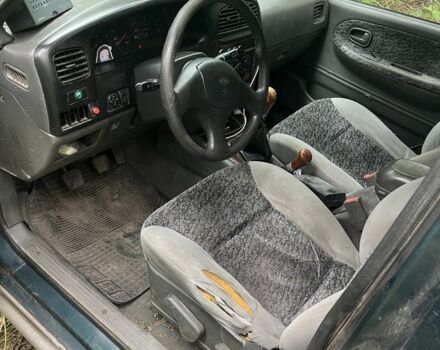 Зеленый Киа Sportage, объемом двигателя 2 л и пробегом 300 тыс. км за 3000 $, фото 4 на Automoto.ua