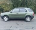 Зеленый Киа Sportage, объемом двигателя 2 л и пробегом 300 тыс. км за 4117 $, фото 1 на Automoto.ua