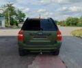 Зеленый Киа Sportage, объемом двигателя 2 л и пробегом 290 тыс. км за 4100 $, фото 7 на Automoto.ua