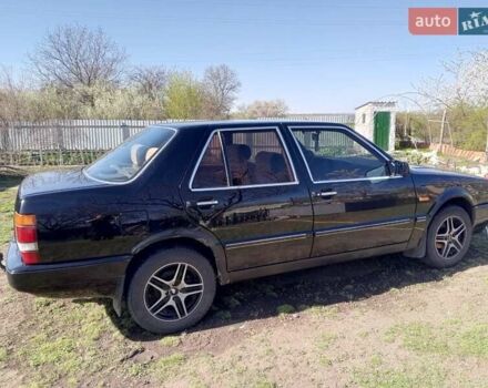 Черный Лянча Тема, объемом двигателя 2 л и пробегом 200 тыс. км за 1200 $, фото 1 на Automoto.ua
