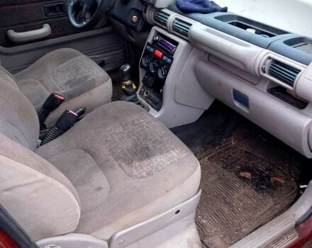 Червоний Ленд Ровер Freelander, об'ємом двигуна 2 л та пробігом 200 тис. км за 1650 $, фото 4 на Automoto.ua