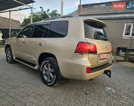 Бежевый Лексус ЛХ, объемом двигателя 5.66 л и пробегом 220 тыс. км за 25500 $, фото 1 на Automoto.ua