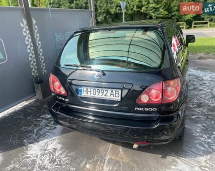 Черный Лексус РХ, объемом двигателя 3 л и пробегом 310 тыс. км за 5400 $, фото 1 на Automoto.ua