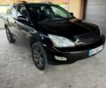 Черный Лексус РХ, объемом двигателя 3.3 л и пробегом 247 тыс. км за 11500 $, фото 1 на Automoto.ua