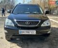 Черный Лексус РХ, объемом двигателя 3.3 л и пробегом 269 тыс. км за 11788 $, фото 1 на Automoto.ua