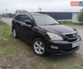 Черный Лексус РХ, объемом двигателя 3.46 л и пробегом 250 тыс. км за 11700 $, фото 1 на Automoto.ua