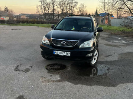 Черный Лексус РХ, объемом двигателя 3.5 л и пробегом 260 тыс. км за 13999 $, фото 1 на Automoto.ua