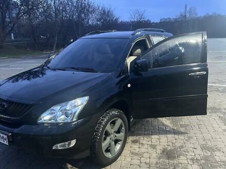 Черный Лексус РХ, объемом двигателя 3.46 л и пробегом 167 тыс. км за 11500 $, фото 1 на Automoto.ua