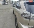 Желтый Лексус РХ, объемом двигателя 3.46 л и пробегом 163 тыс. км за 12800 $, фото 1 на Automoto.ua