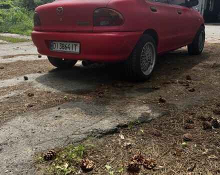 Красный Мазда 121, объемом двигателя 1.3 л и пробегом 333 тыс. км за 1650 $, фото 2 на Automoto.ua