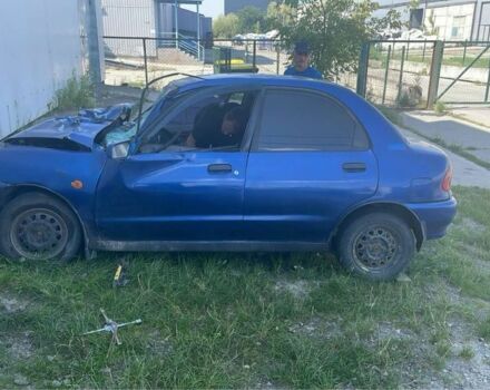 Синий Мазда 121, объемом двигателя 1.3 л и пробегом 250 тыс. км за 350 $, фото 1 на Automoto.ua